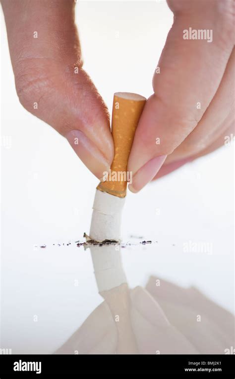 Hand Putting Out Cigarette Stock Photo Alamy