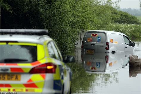 Uk Weather Rain Leaves A Van Submerged On A Flooded Road Daily Mail