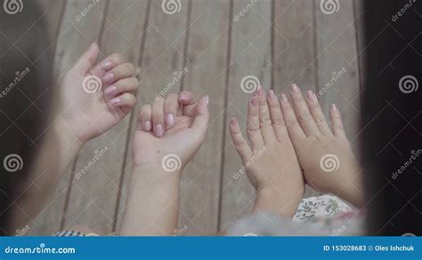 Two Cute Girls Sitting Outdoors Together Chatting About New Manicure Showing Fingers And Nails