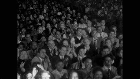 audience applauding theater spotlight pans left Stock Footage Video ...