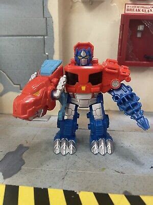 Playskool Heroes Transformers Optimus Prime Dino Rescue Bots Action