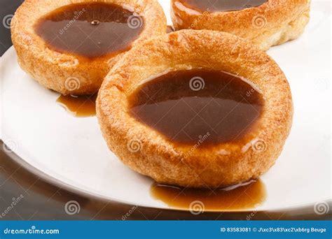 Fresh Baked Yorkshire Pudding British Food With Gravy On A Plate