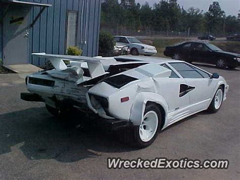 A White Sports Car Parked In A Parking Lot