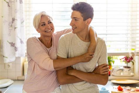 Mother Hugging Her Teenage Son Stock Image Image Of Life Love 190134119