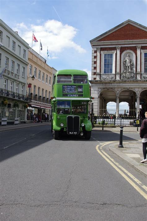 Green Double Decker Bus in City Street