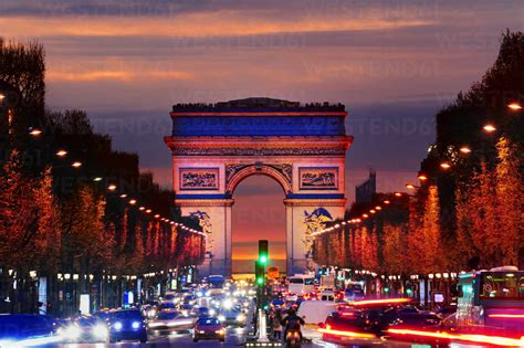 Arc De Triomphe Over Traffic At Night Paris Ile De France France