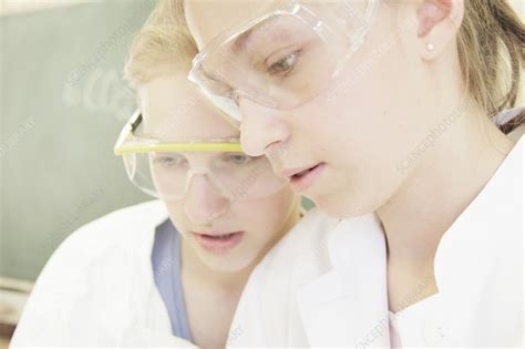 Students wearing safety goggles in lab - Stock Image - F005/8362 - Science Photo Library