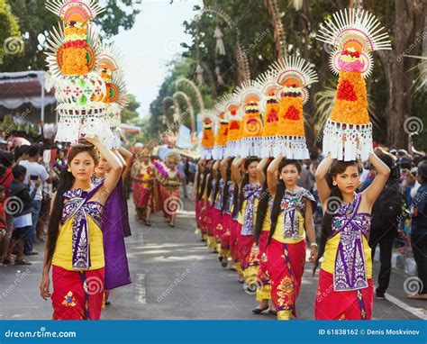 Procession Of Balinese Women Carrying On Heads Religious Offering