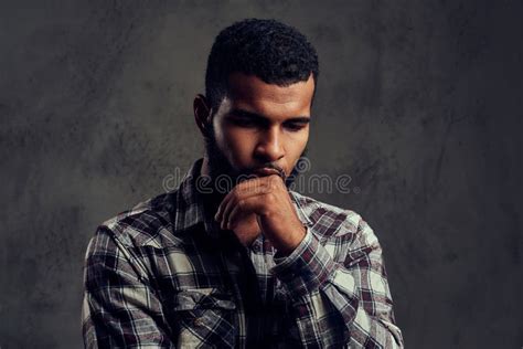 Portrait Of A Pensive African American Guy With A Beard Wearing A