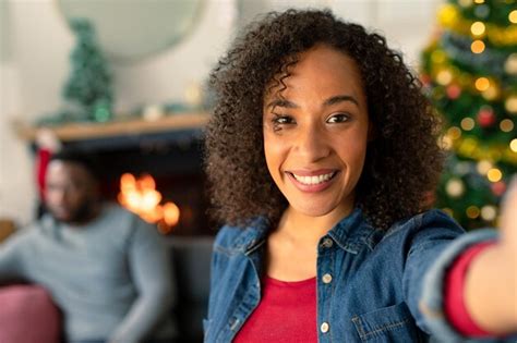 Premium Photo Happy African American Woman Taking Selfie Christmas