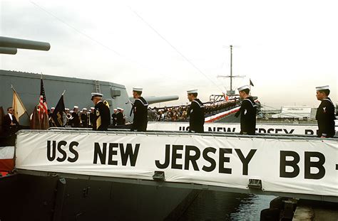 Crewmen Go Aboard The Battleship Uss New Jersey Bb During Its