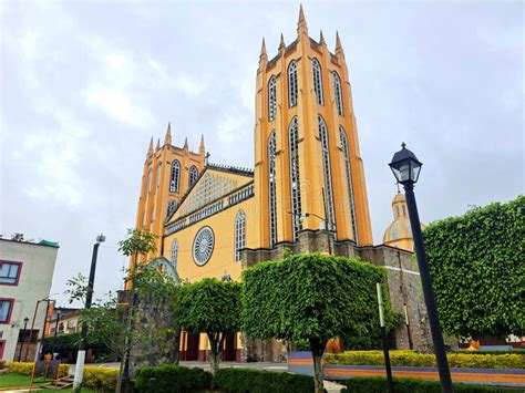 Parish Of San Juan Bautista In Front Of The Gardens Of The Plaza In The