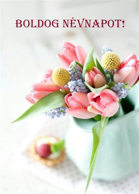 A Vase Filled With Pink Flowers On Top Of A Table