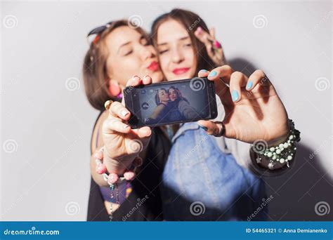 Two Beautiful Brunette Women Girls Teenagers Spend Time Together Having Fun Make Funny Faces