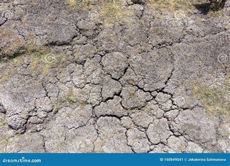 Dry Earth With Cracks On Arid Soil Surface Seen From Above