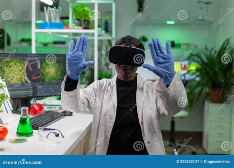 Scientist Biologist Man Putting Chemical Fluid In Petri Dish Using