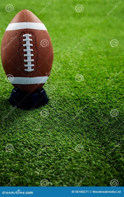 American Football Standing on Holder Stock Image - Image of american ...