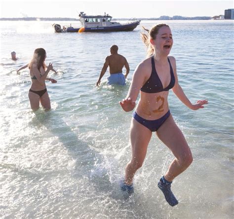 Polar Bear Dips Canadas Bravest Ring In The New Year With An Icy Swim