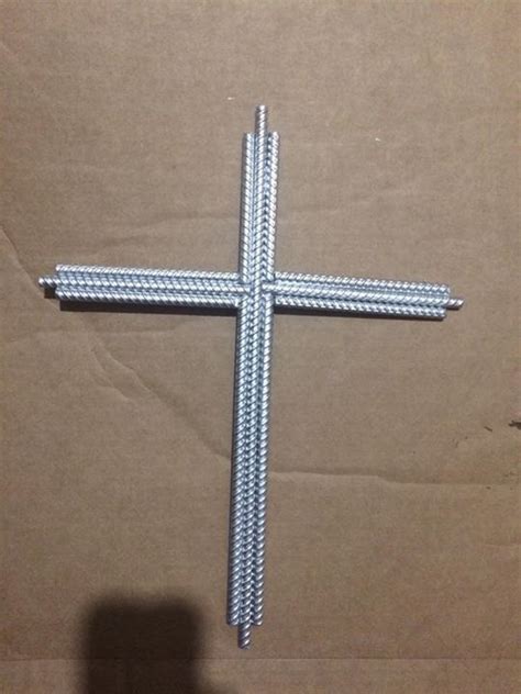 A Metal Cross Sitting On Top Of A Cardboard Box