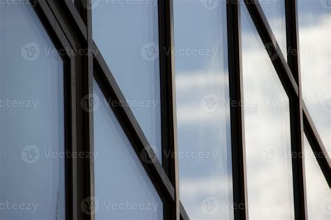 Huge modern windows with blue sky and clouds reflection, horizontal