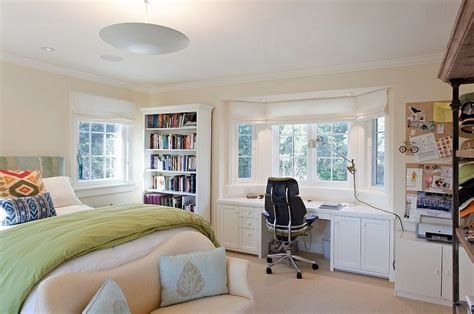 A Bedroom With A Bed Desk And Bookshelf In It S Corner