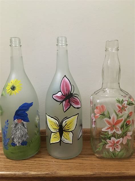 Painted bottles with lights | Bottle painting, Bottle crafts, Bottle art