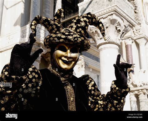 black gold jester costume Venice carnival Stock Photo - Alamy