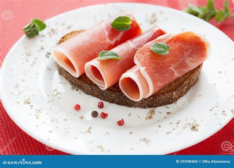 Slices Of Delicious Ham Rolled Into A Tube On A Plate Stock Photo