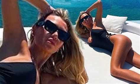 Christine Mcguinness Shows Off Her Long Legs In A Black Swimsuit