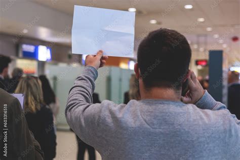 Meeting At The Airport Person Holding A Placard Card Sign With Welcome Title Text Greeting