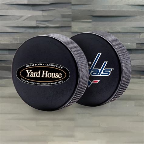 Monumental Sports & Entertainment Hockey Pucks - Strategic Factory