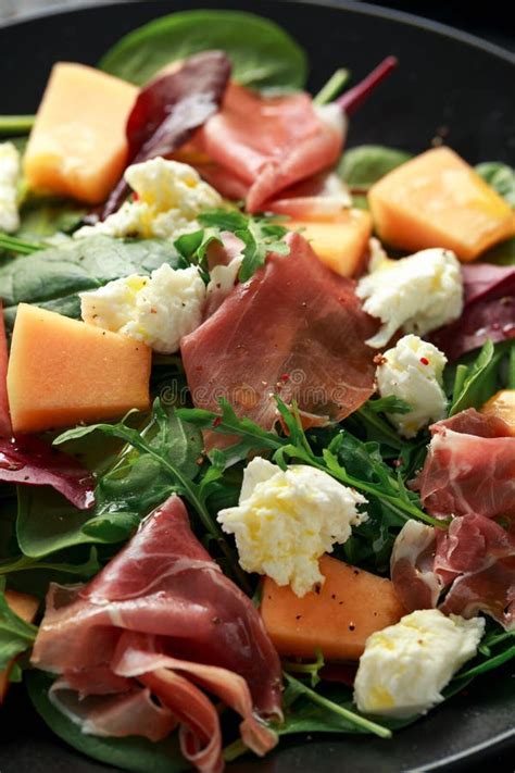 Parma Ham And Melon Salad With Mozzarella Green Leaves Mix Stock Photo