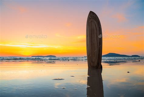 Surfboard On The Beach In Sea Shore At Sunset Time Stock Photo By Netfalls