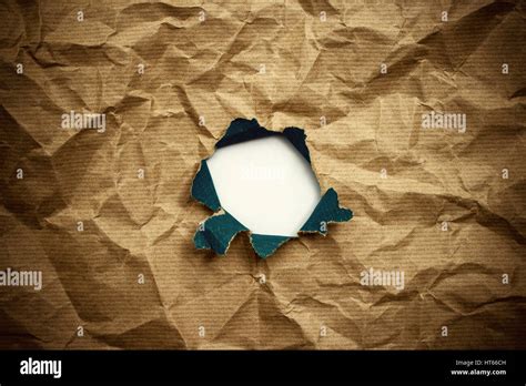 Torn Hole In Brown Crumpled Wrapping Paper Stock Photo Alamy