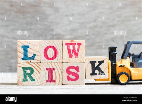 Toy Forklift Hold Letter Block K To Complete Word Low Risk On Wood