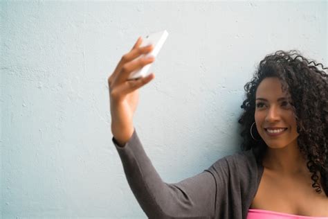 Free Photo Portrait Of Afro Woman Taking Selfies With Her Mophile