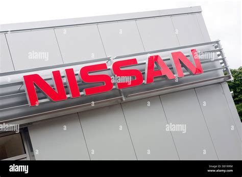 The Exterior Of A Nissan Car Dealership In The Uk With A Large Nissan