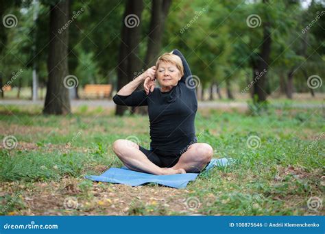 Fantastic Old Woman On A Yoga Training On An Outdoors Background Sport