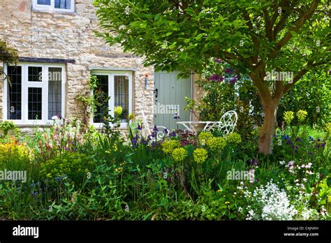 A Pretty English Country Front Garden In The Cotswolds In Spring Or