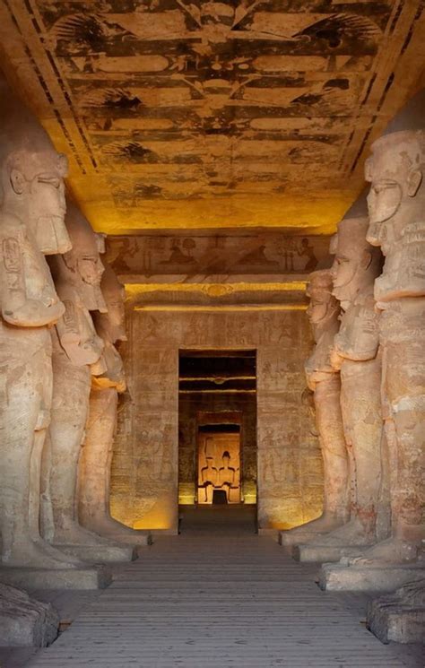 The Entrance To An Egyptian Temple With Statues On Either Side And