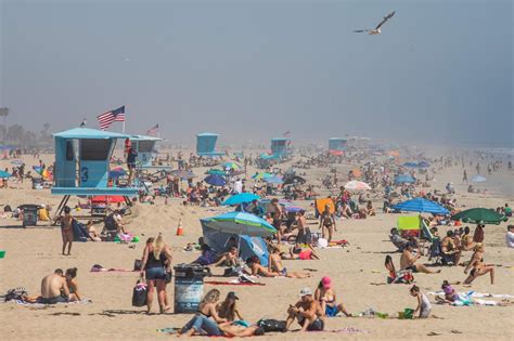 California Heat Wave Draws Large Crowds To Beaches Despite Stay At Home