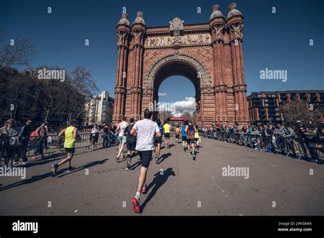 Runners Passing Through The Arc De Triomf In The Barcelona