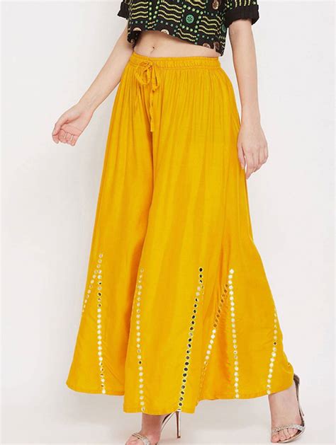 Women Mustard Yellow Embellished Flared Ethnic Palazzo