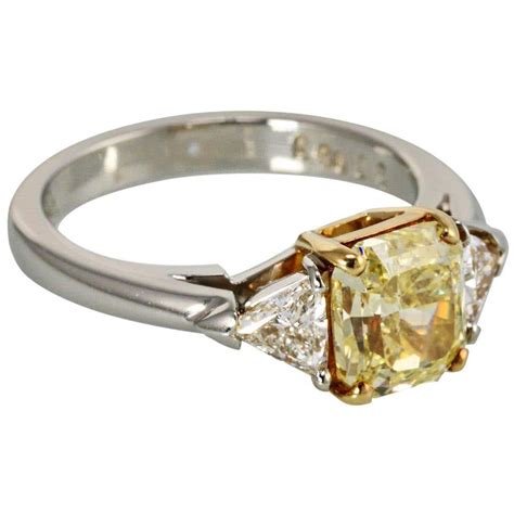 Platinum Three-Stone Fancy Yellow Radiant Cut Diamond Engagement Ring ...