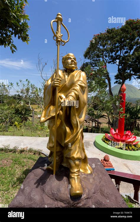 fat monk statue in complex Pagoda Ekayana Stock Photo - Alamy