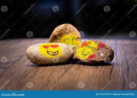 Painted Pebbles with Emoji Faces on a Table Stock Image - Image of arts ...