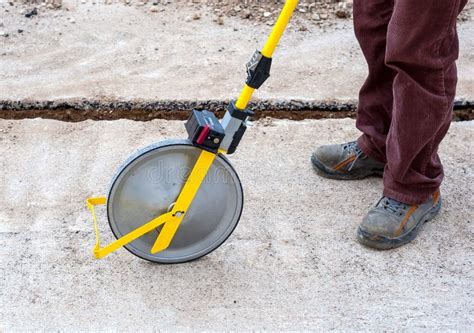 Surveyor With Measuring Wheel Odometer Stock Photo Image Of Site