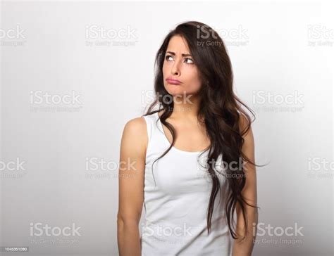 Confusion Suspected Brunette Woman Thinking And Looking Unhappy In