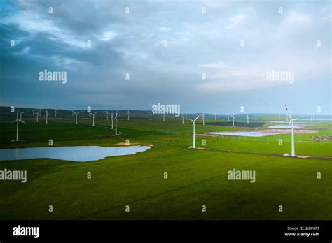 Wind Turbine Farm At Sunset Renewable Energy Concept Producing Alernative Energy In Windmills