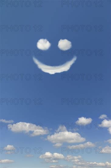 Clouds Forming Smiley Face In Sky Photo12 Tetra Images